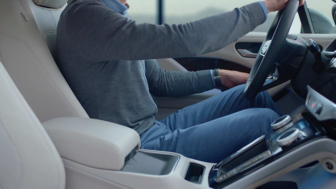 View Of Jaguar I-Pace Driver Seat Whilst Man Is Driving